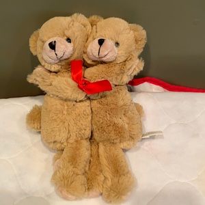 Hugging stuffed teddy bears